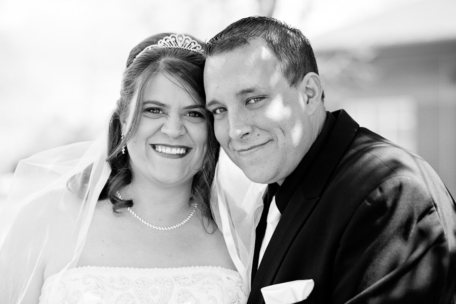black and white photo of a bride and groom posing