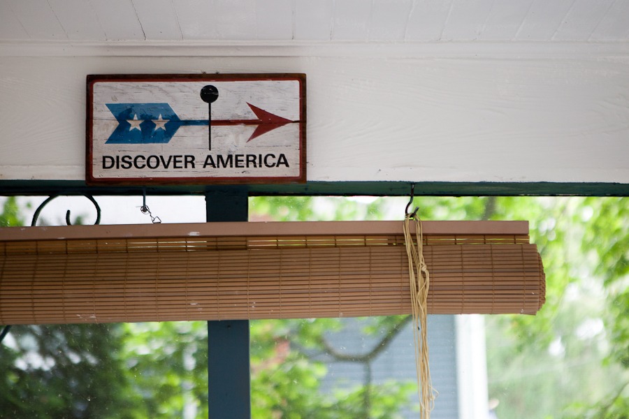 a sign on a porch that reads discover america
