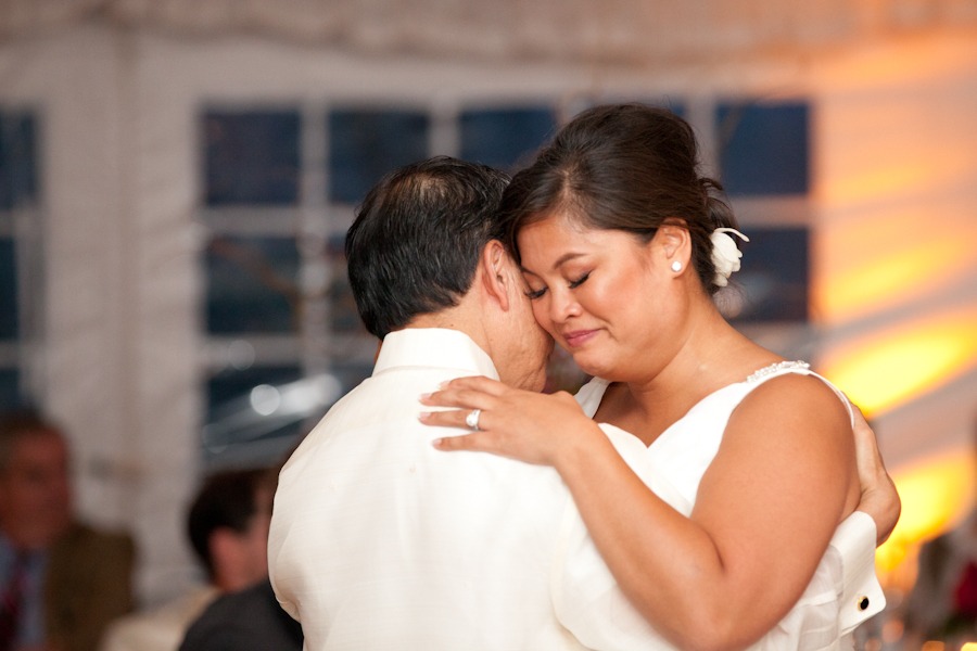 a bride closes her eyes and dances with her dad