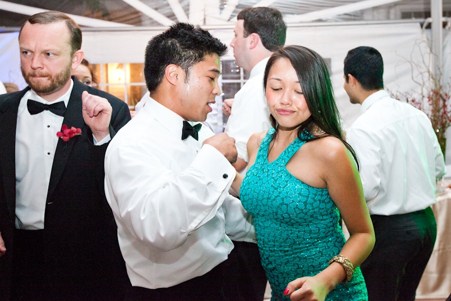 a woman in a fashionable dress dances with a man with a bowtie