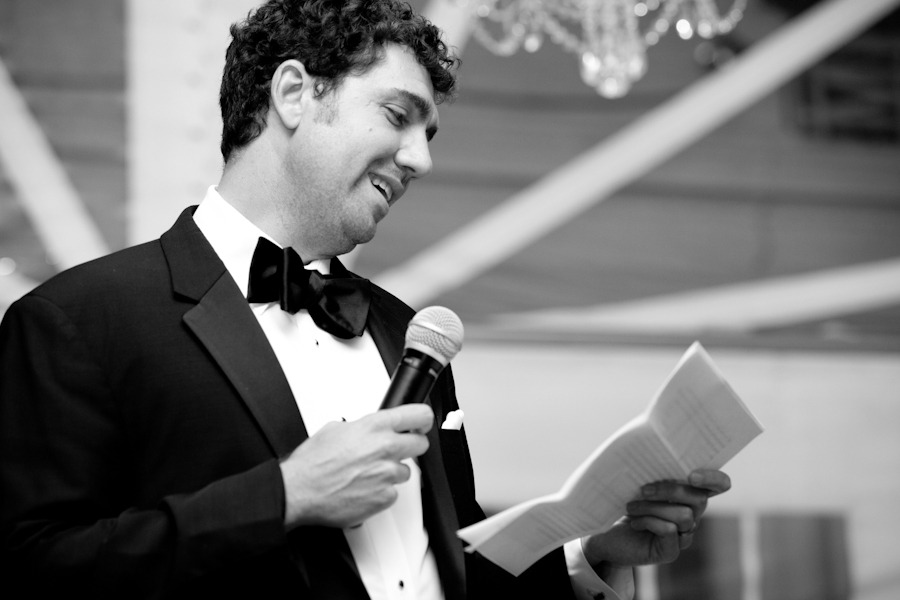 black and white photo of a man reading a speech