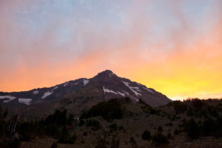 sun sets behind an Oregon mountain