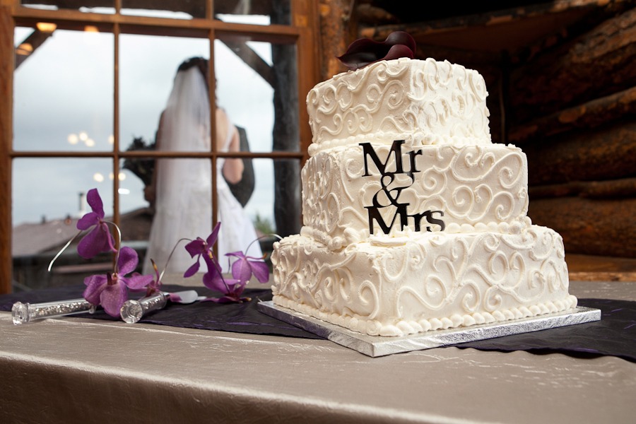 a white wedding cake in front of window