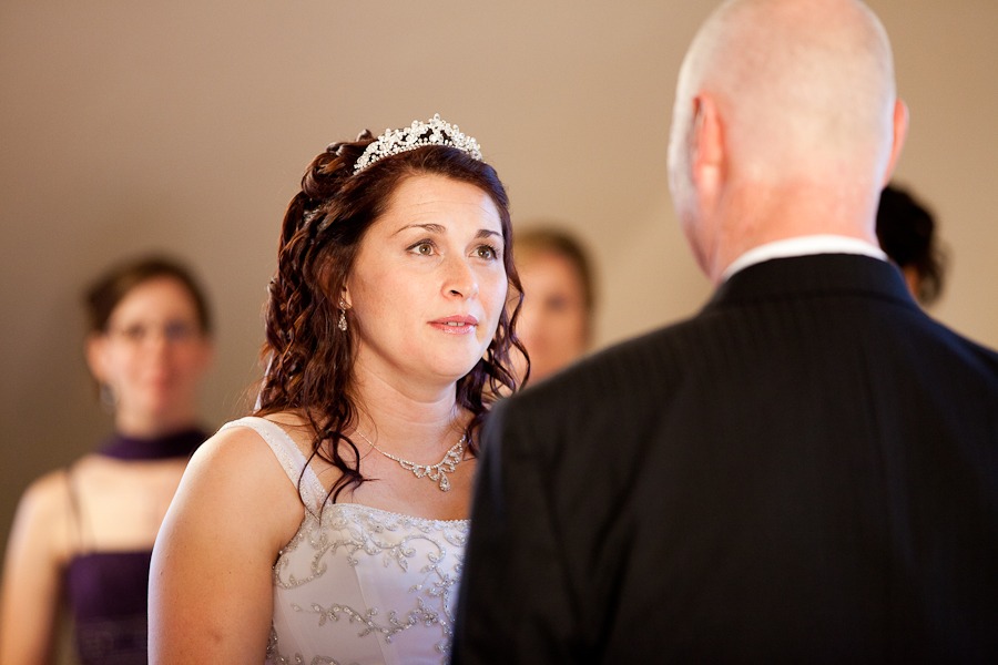 a bride looks at her new husband during a wedding ceremony