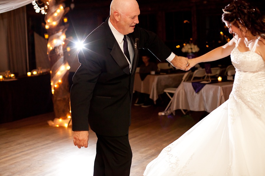 a groom spins a bride