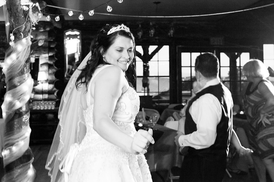 black and white photo of a bride dancing