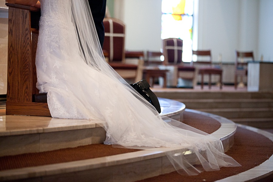 a long dress and veil hang down church altar steps