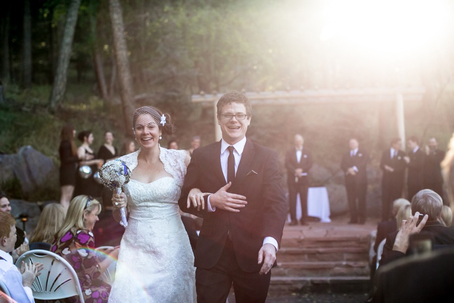 a colorado bride and groom walk down the aisle after their outdoor wedding ceremony