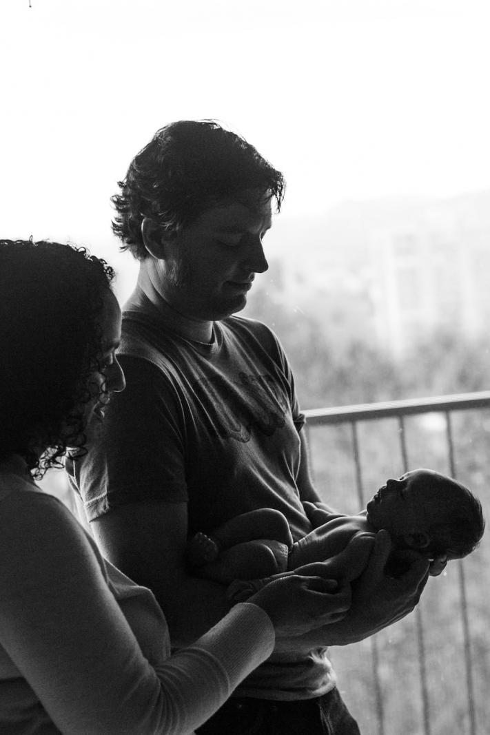 silhouette of a dad holding his baby