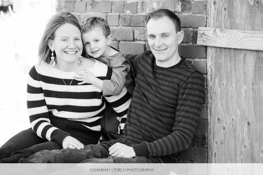 black and white image of a family of three