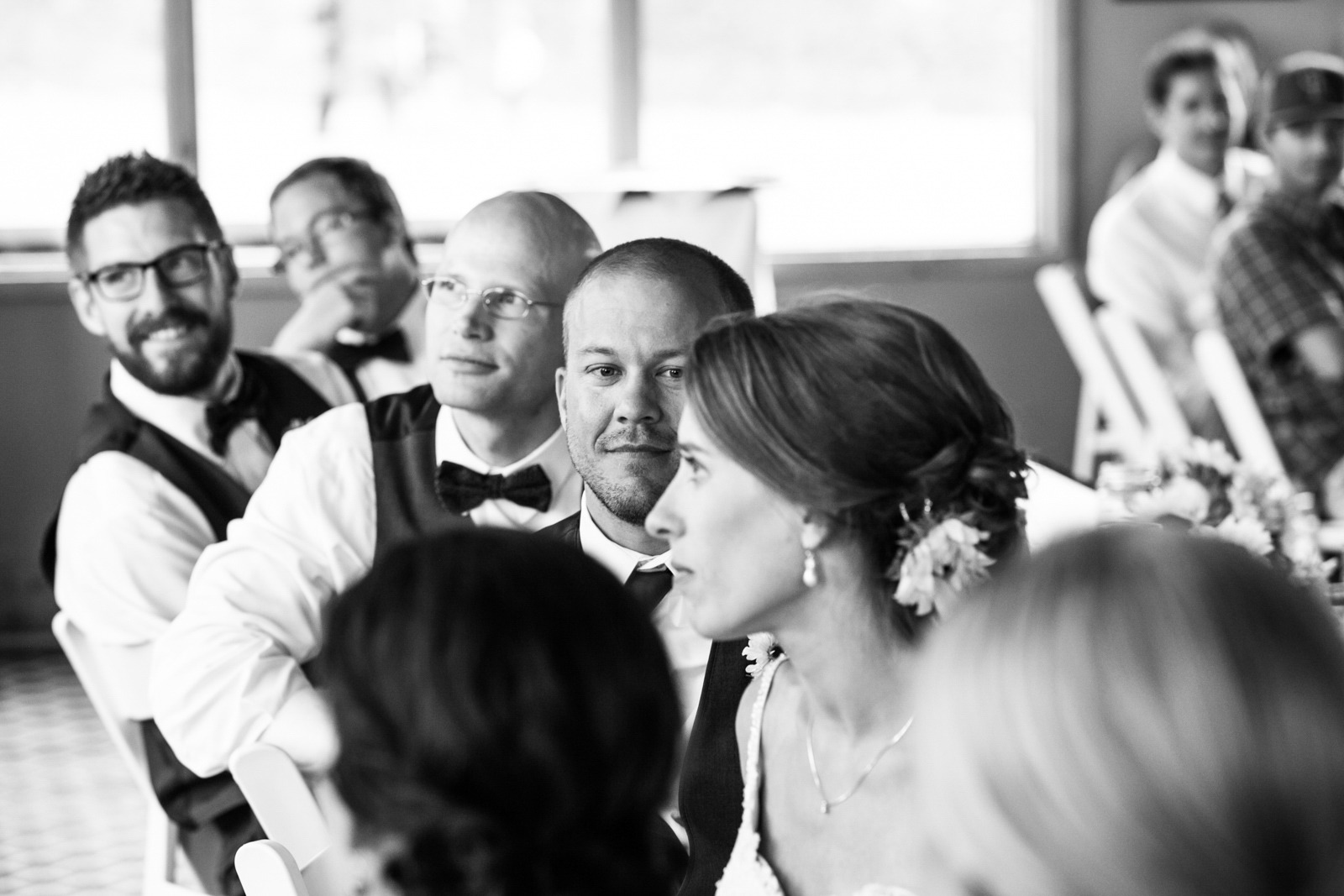black and white photo of a groom looking at bride
