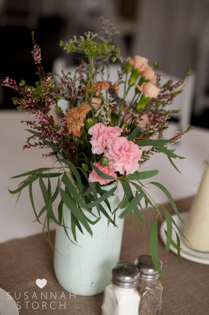mint green mason jars with flowers
