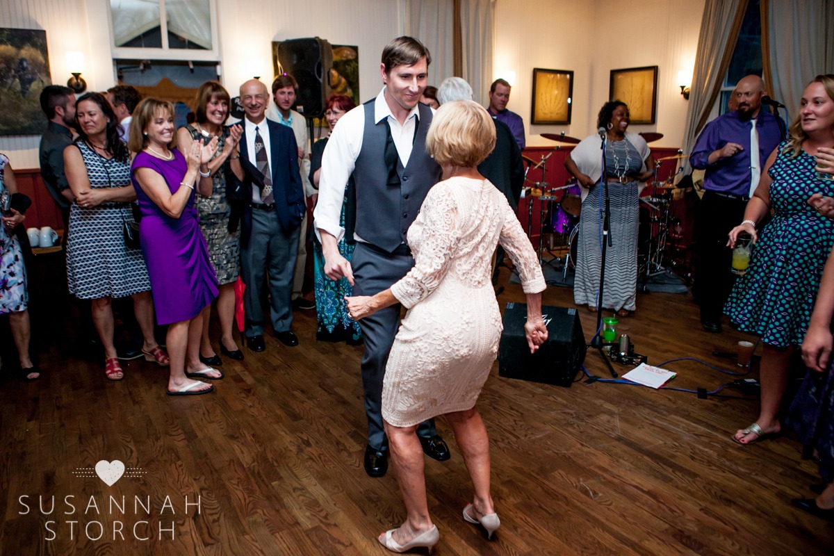 a groom dances with his mom