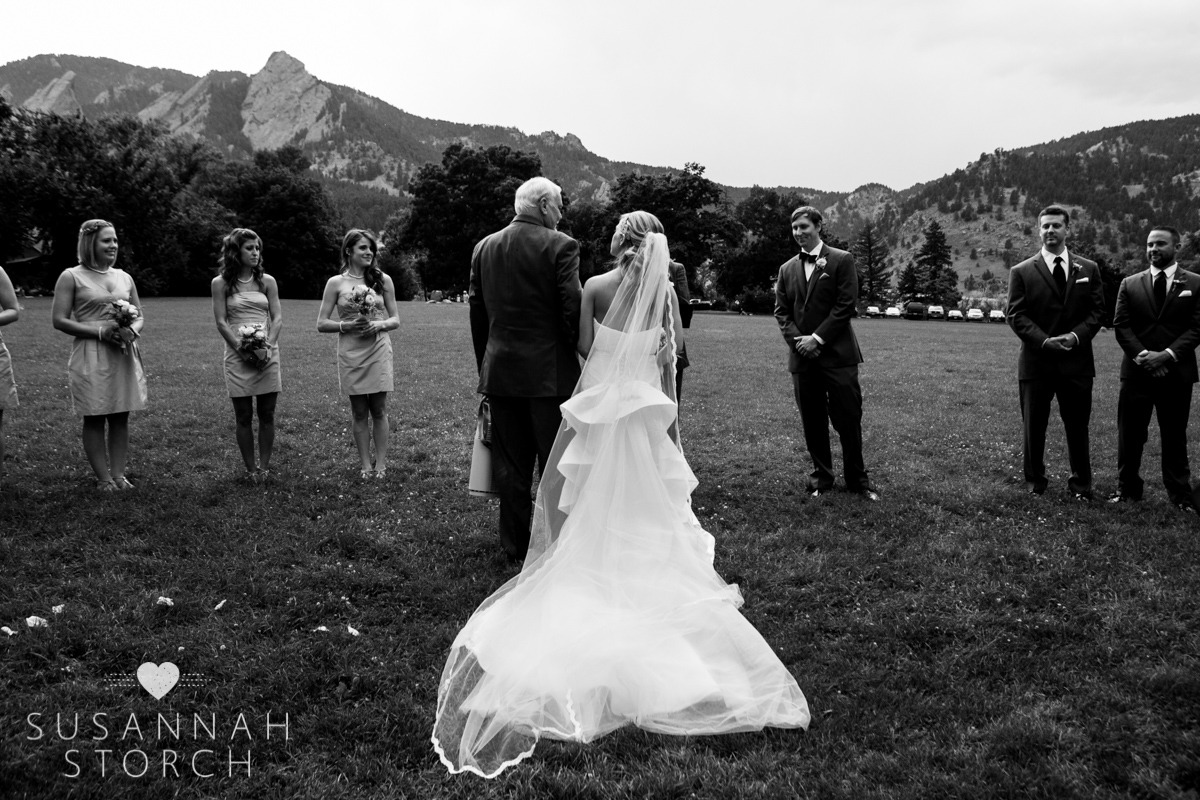 b/w photo of a dad walking his daughter down the aisle