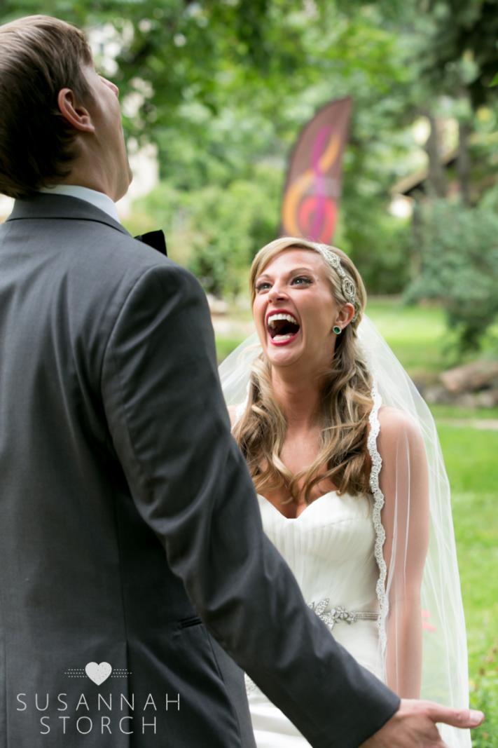 a happy bride looks up to her husband