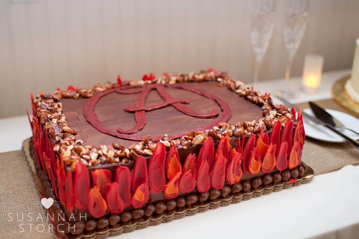 a red letter A and frosting flames decorate a chocolatey cake