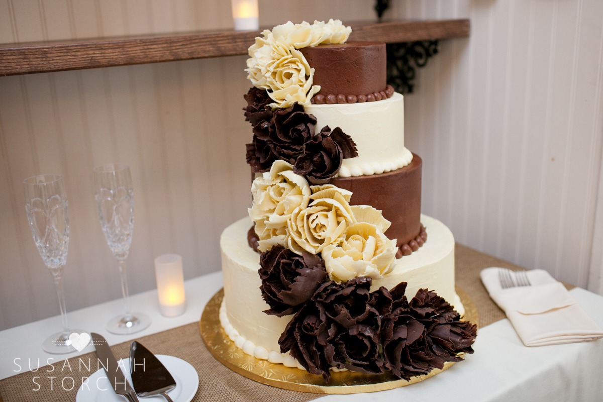 chocolate flowers decorate a four-tiered wedding cake