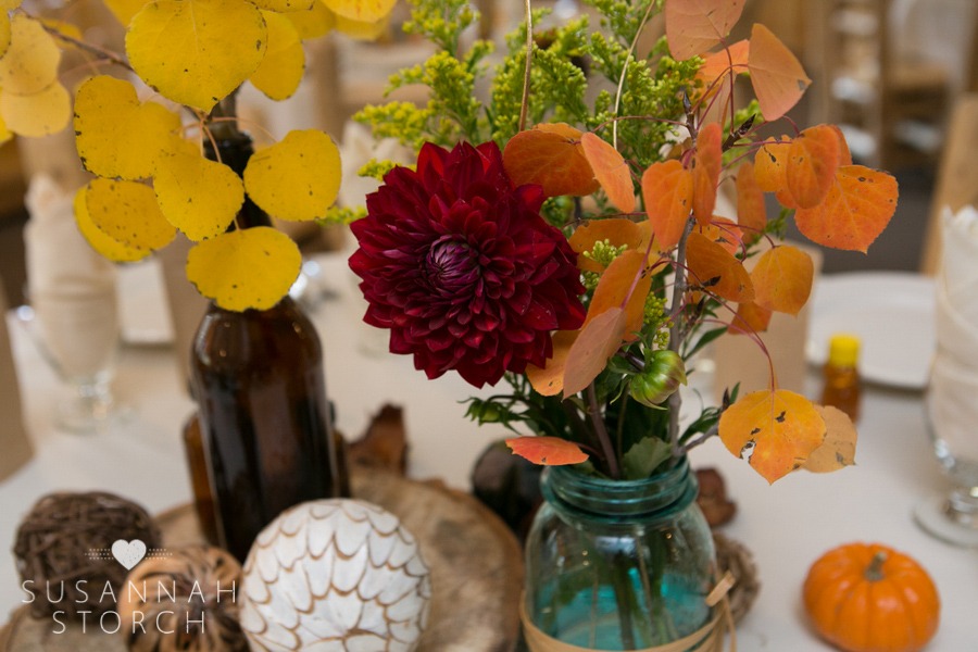 mums, aspens, and fall color decorate a wedding reception table