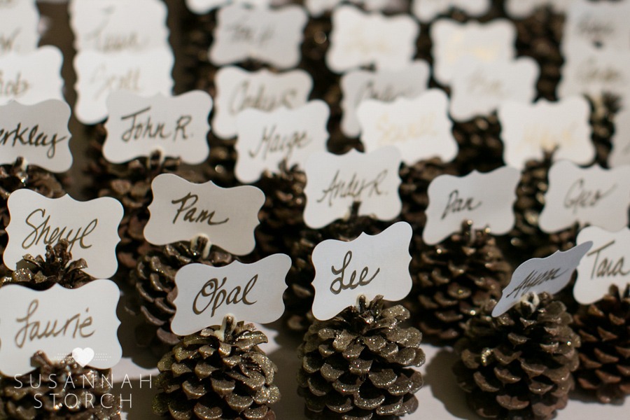 glittery pinecones hold the names of wedding guests