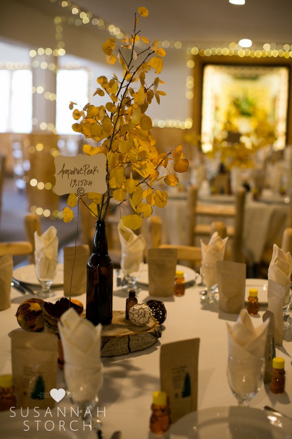 a table decorated with aspen leaves and more