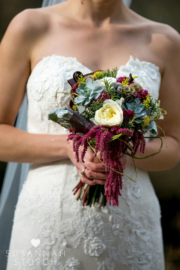 a bride holds her wedding bouquet