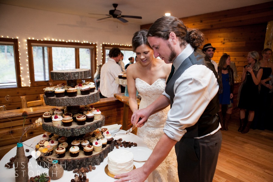wedding couple cut a white wedding cake