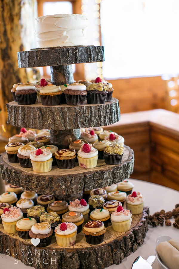 cupcakes sit on a platter made out of sections of an old tree