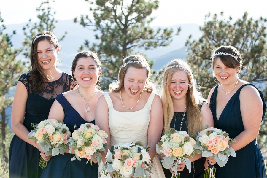 a bride and her bridesmaids giggle
