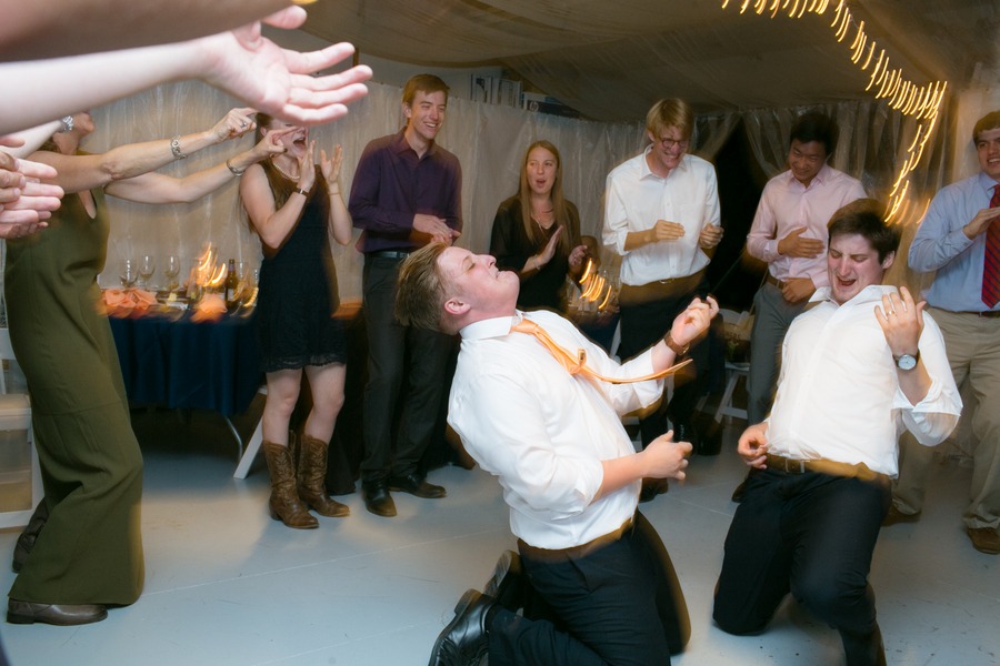 a groom and his best man air guitar dance