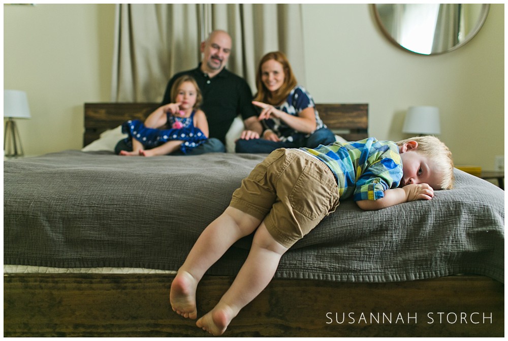 boulder-boy-and-family-photo-on-bed