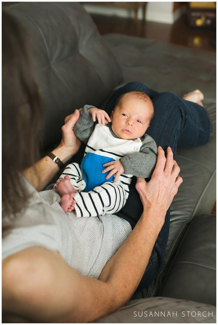 erie colorado newborn photography with baby lying on grandma's lap