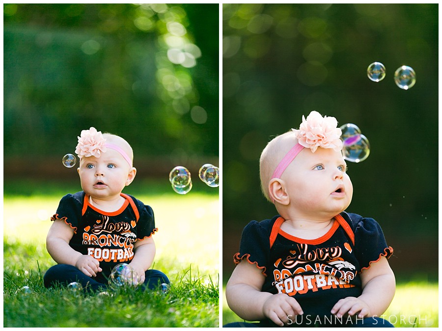a baby watches floating bubbles