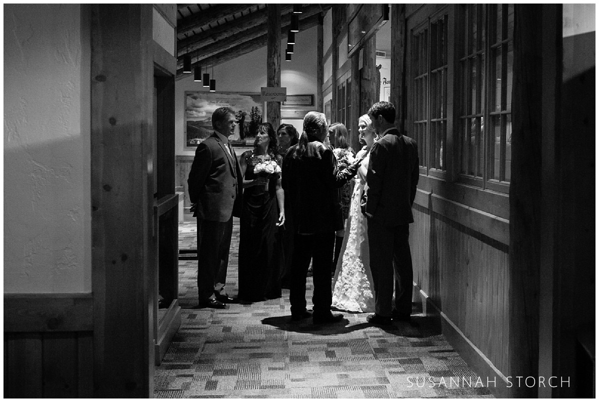 black and white picture of a wedding party waiting