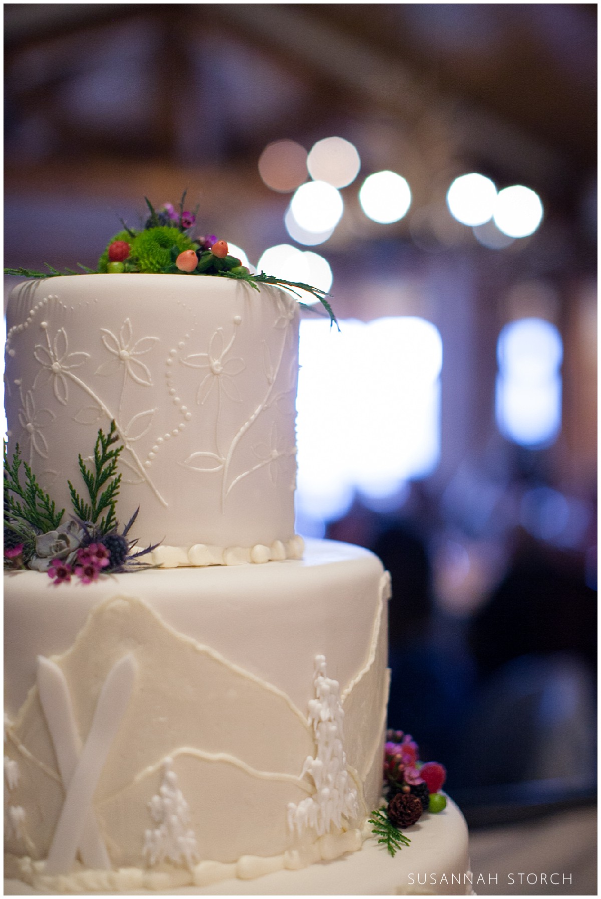image of a wedding cake with skis and mountains