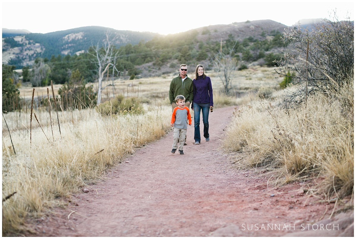 a family hike on a red dirt trail