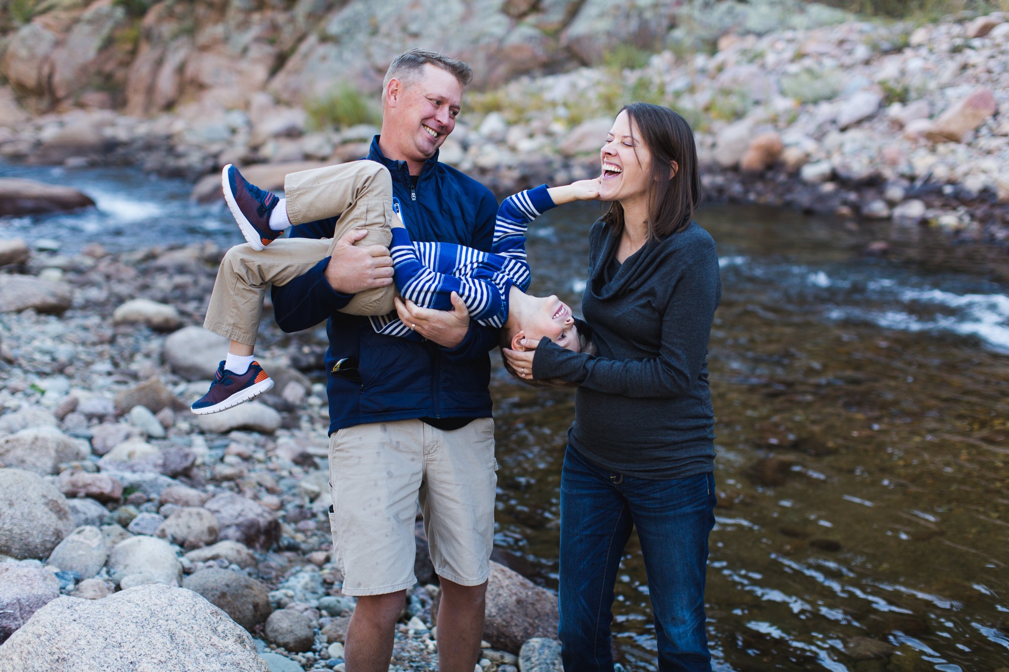 Family laughing by the South St. Vrain River