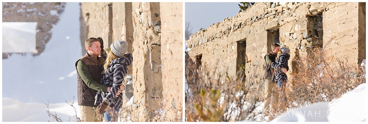 two images of a couple hanging out in snow in front of an old rock building