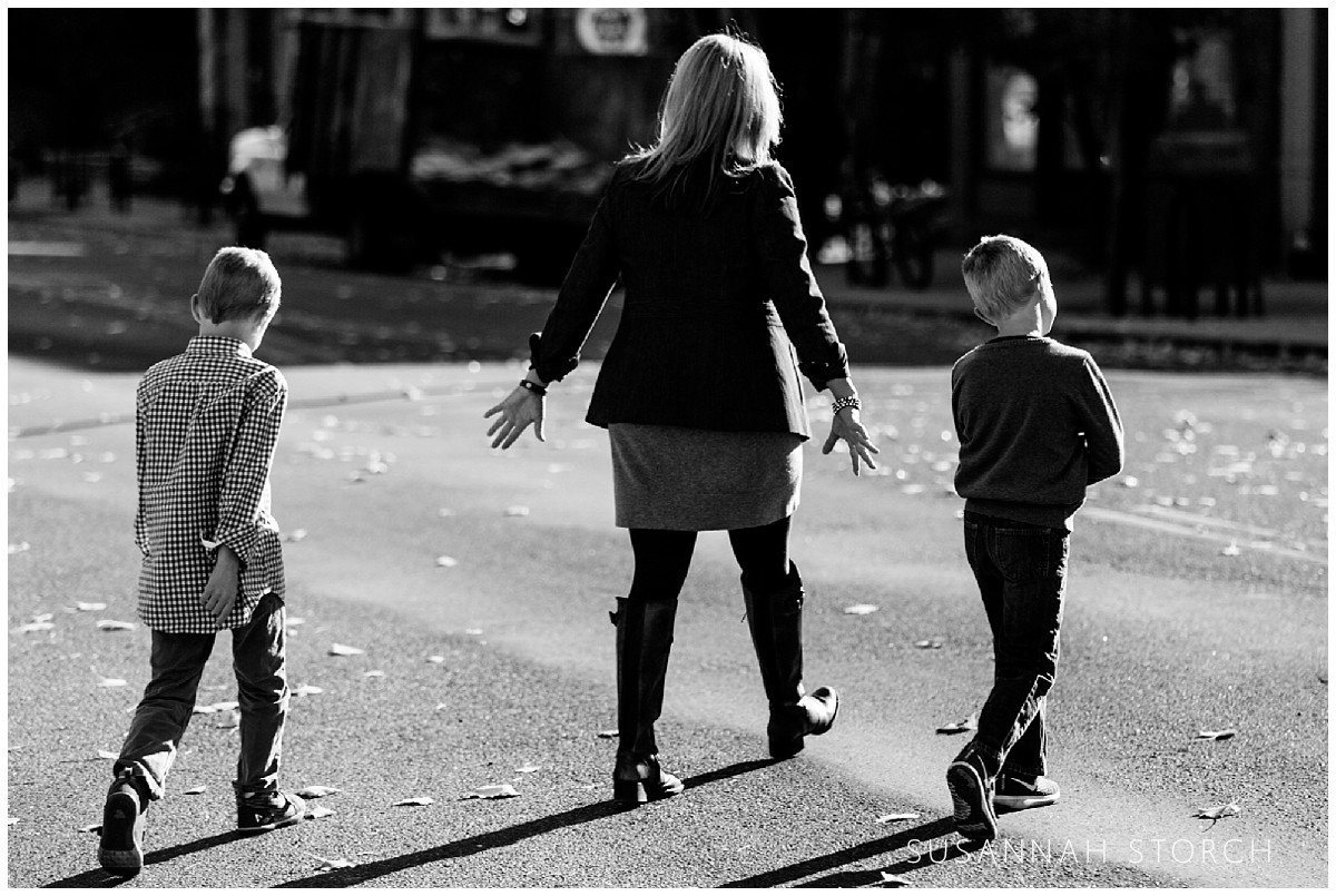 a mom reaches out to her boys and they cross the street