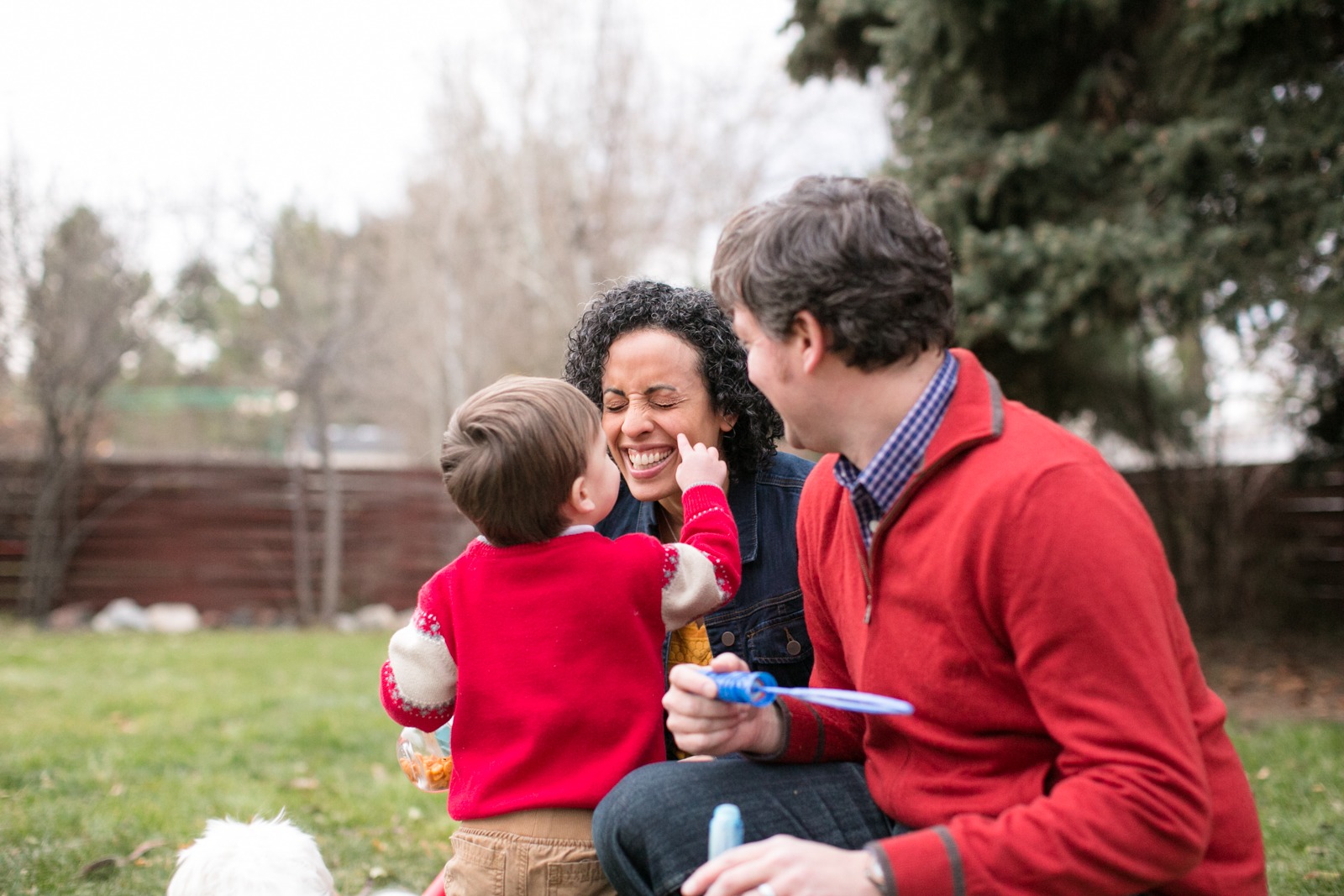 lifestyle family photography taken of a family playing in a denver backyard