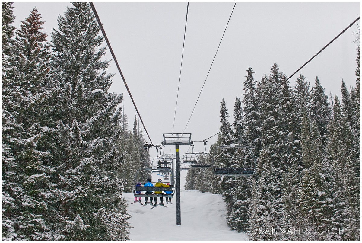 a family on a ski lift