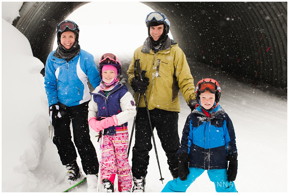 a colorado family posing on a break from skiing