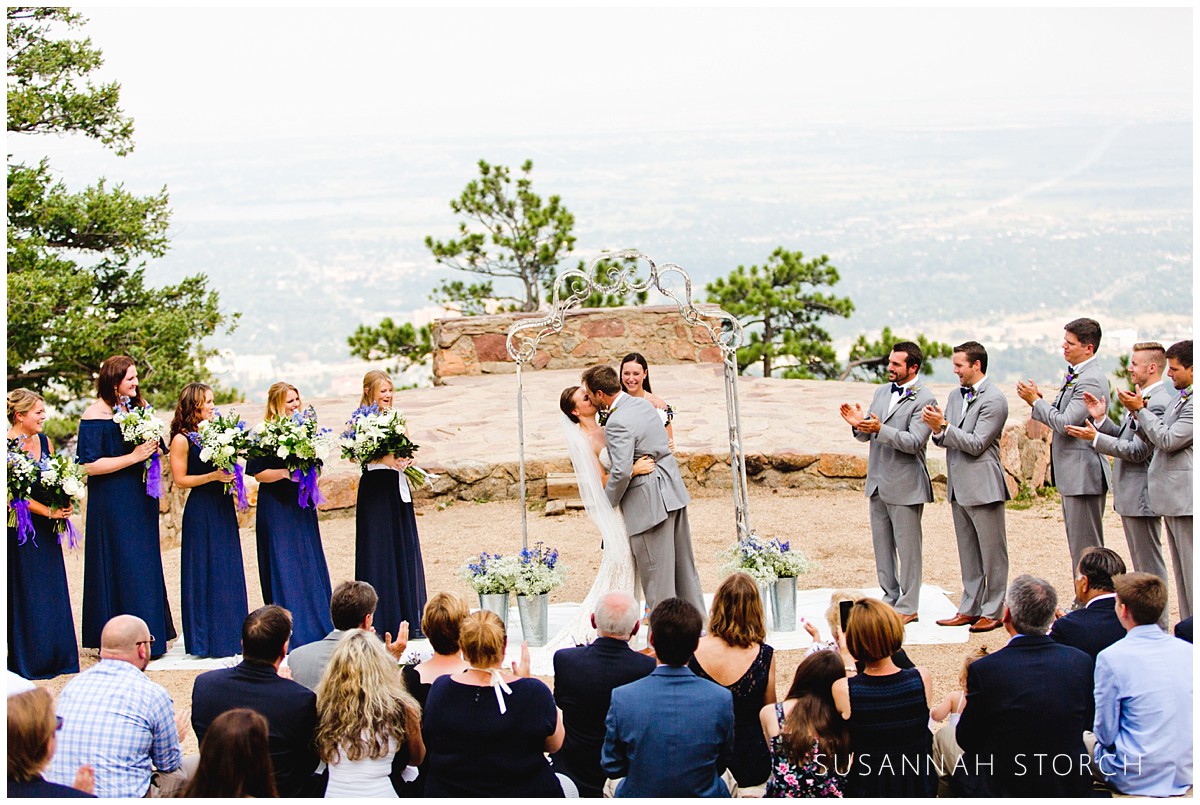outdoor wedding ceremony kiss