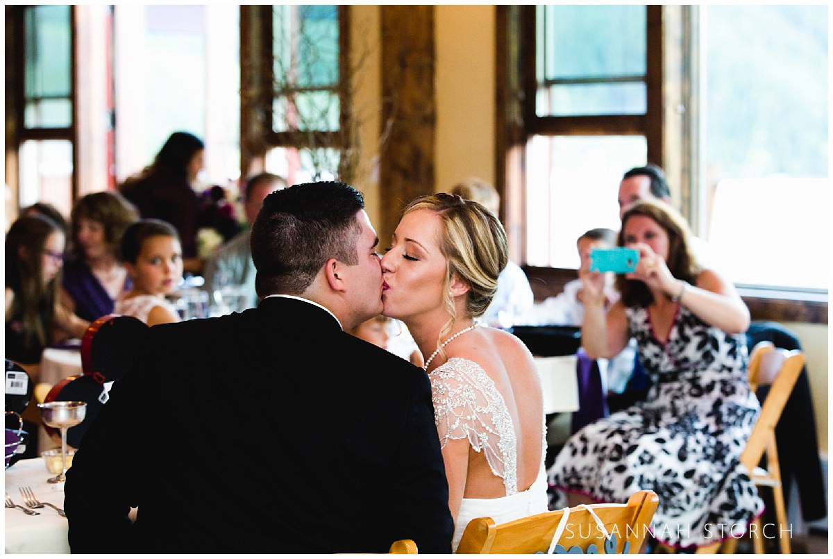 lodge-at-breckenridge-wedding-couple-kiss-during-reception