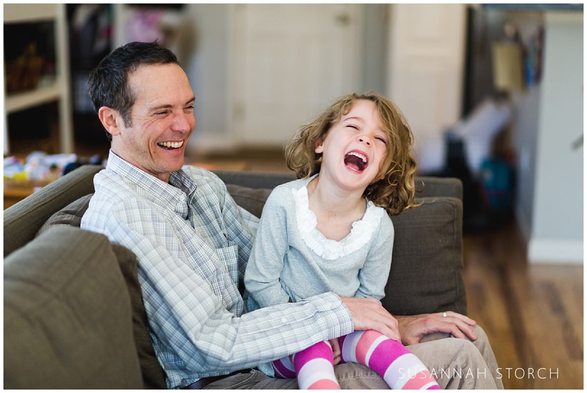 laughing dad and daughter