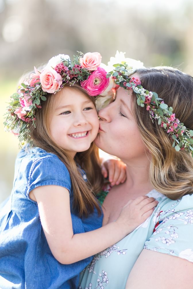 Mom kisses her daughter during a Colorado photography Mother's Day mini session