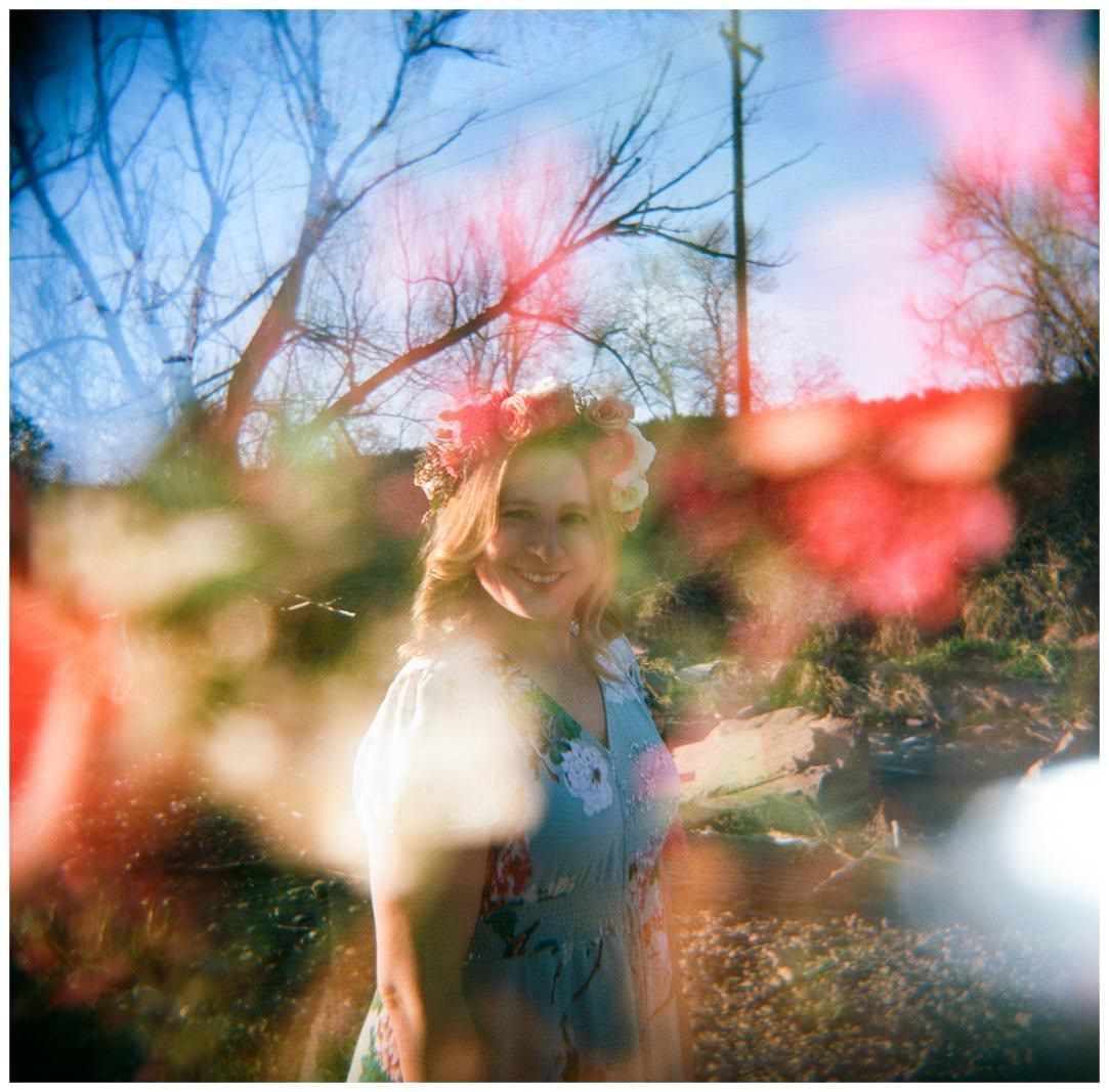 double exposure of a woman in a floral crown