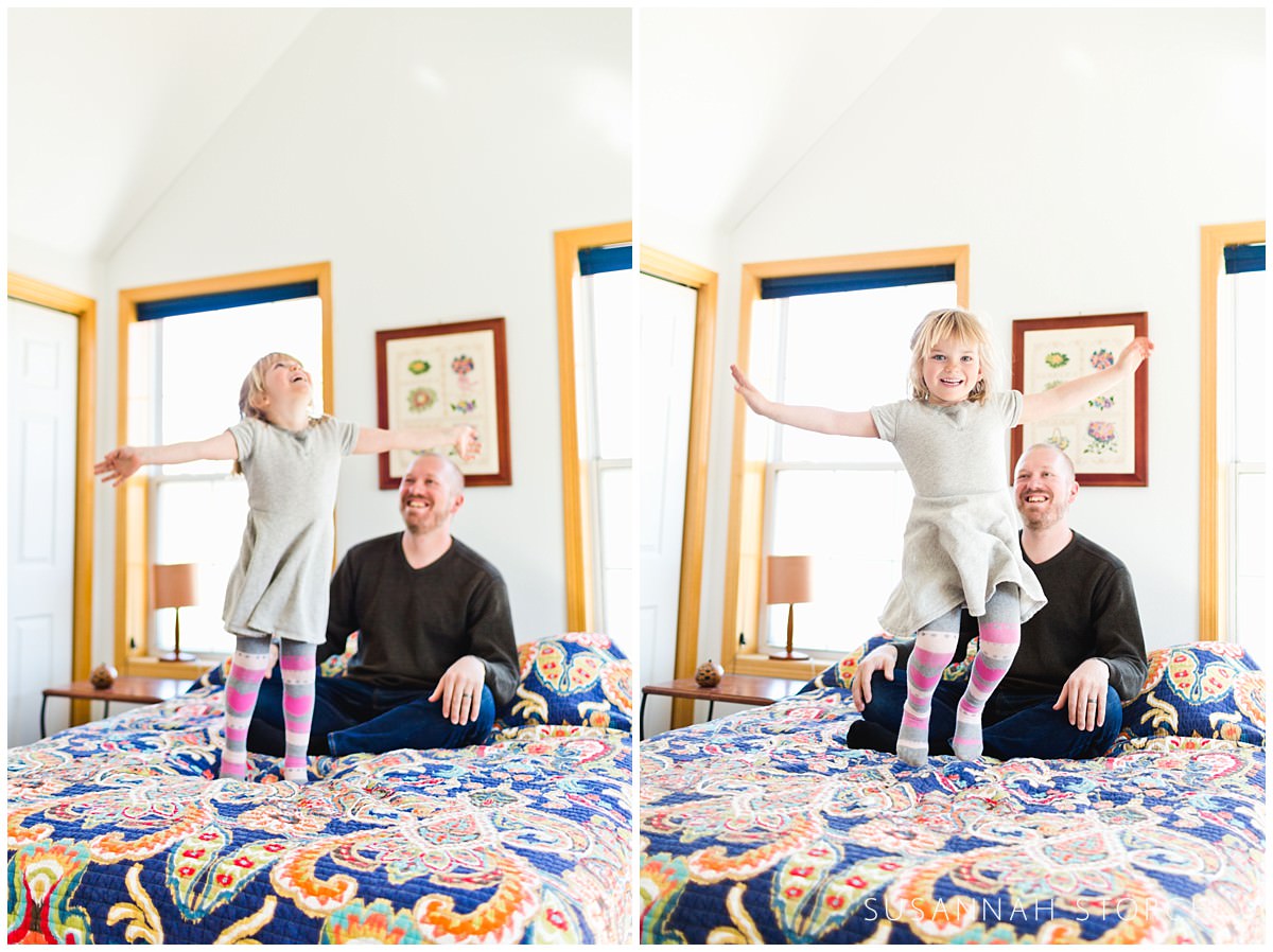 a daughter having fun jumping on a bed