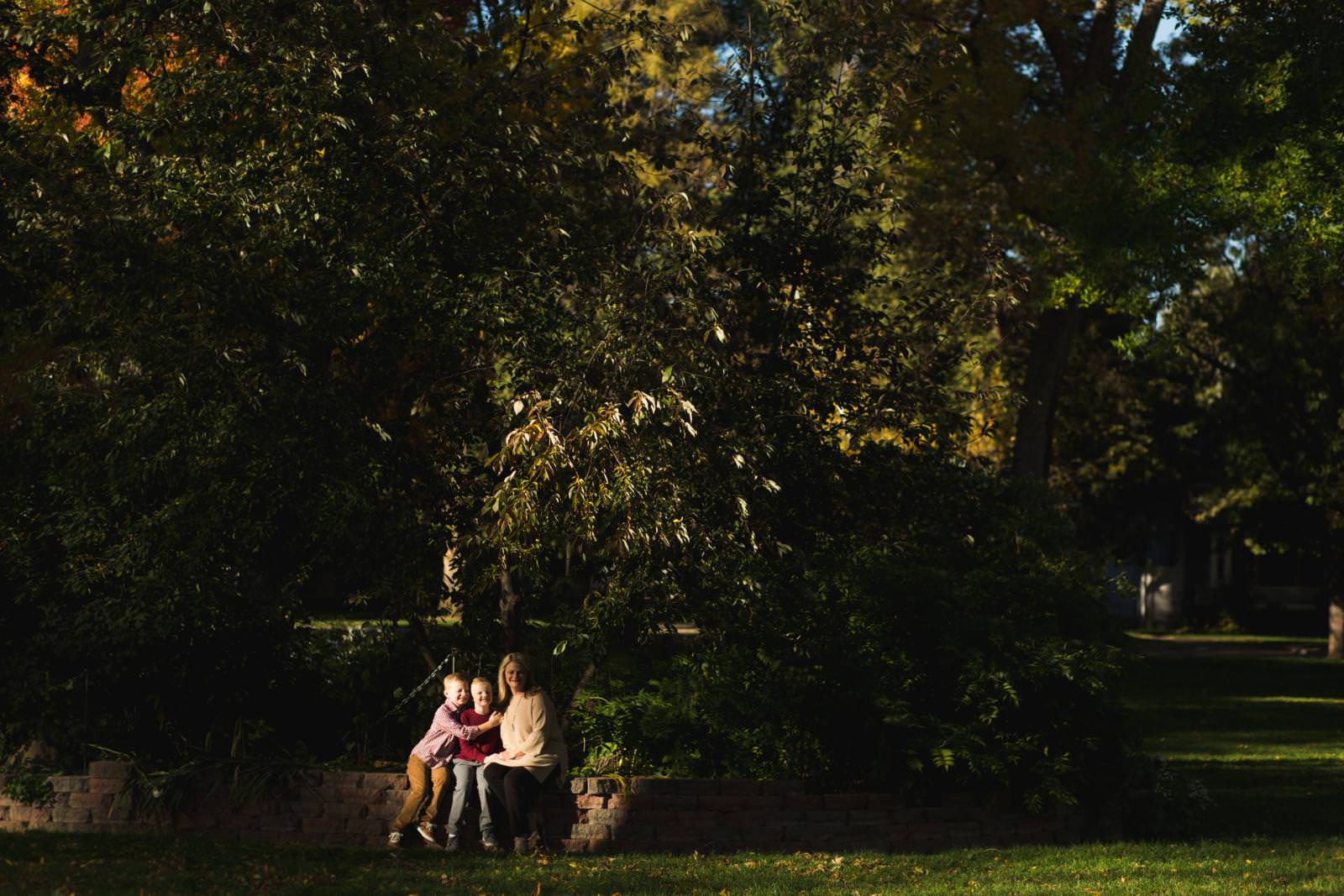 high contrast image of family sitting at a park