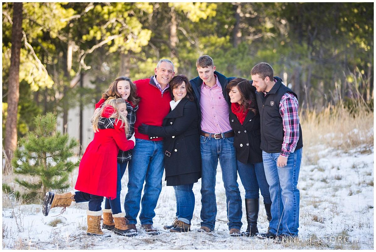 family members pose on a snowy day in nederland, co