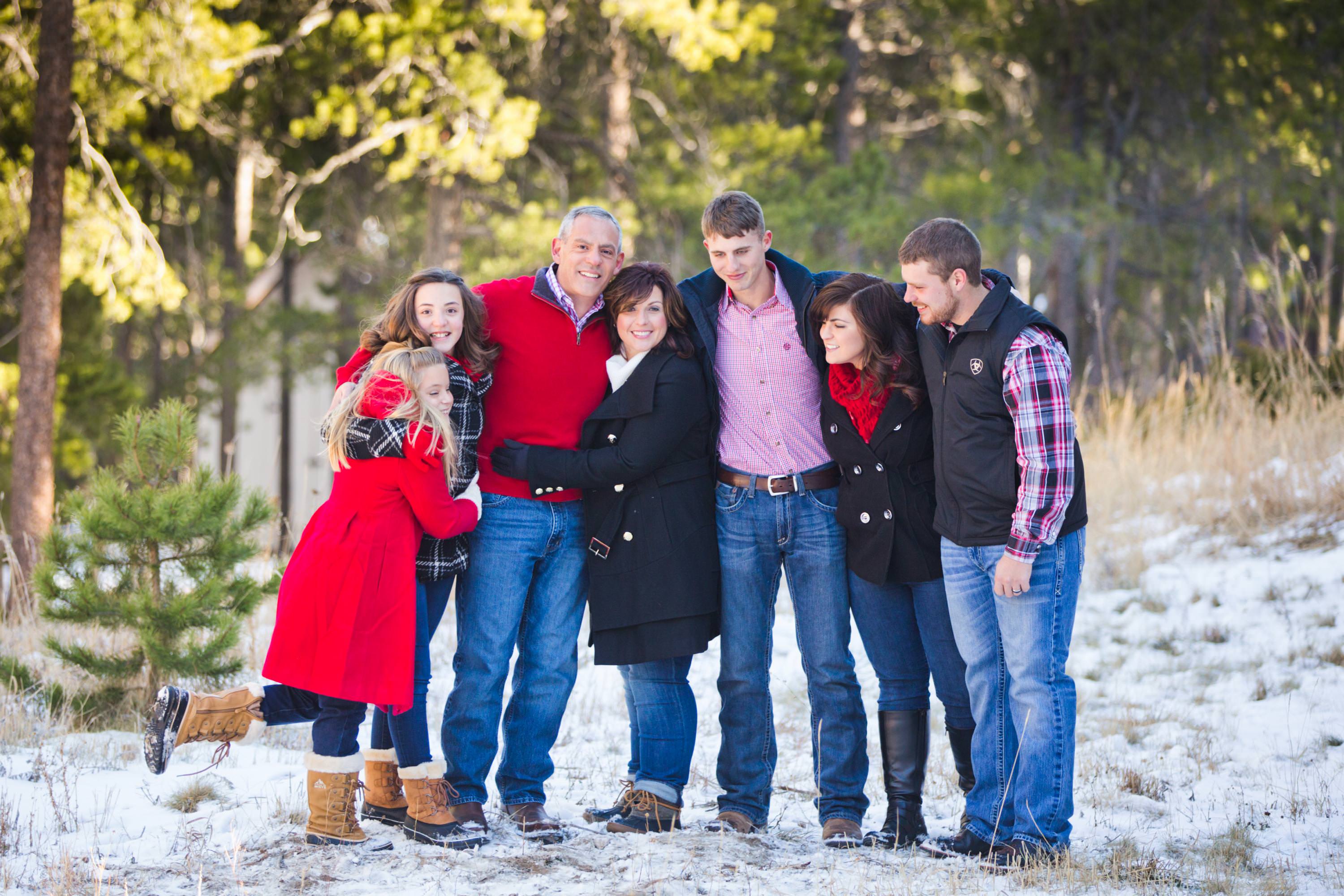 a big family gets a snowy portrait